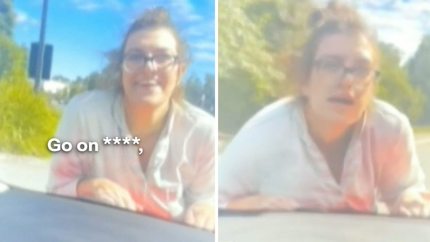 Car swerves along road, trying to shake off woman clinging onto bonnet
