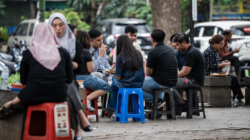 Inside this street food market are signs of a crashing currency