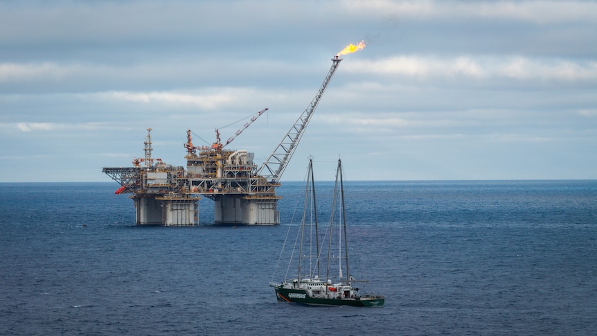Two people in custody after protest at offshore Woodside gas platform